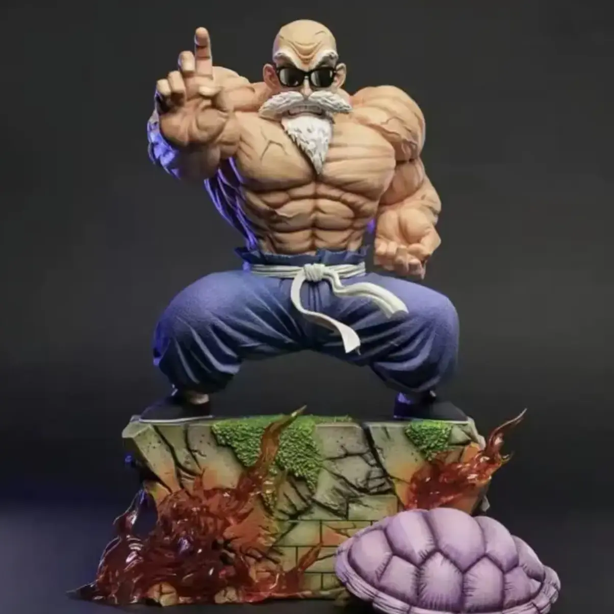 Master Roshi collectible figure in martial arts pose with fiery base and turtle shell