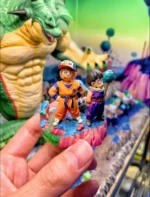 Dragon Ball Statue: Krillin & Gohan mini figures in orange & purple gi, KULI IN cap, standing on a colorful platform.