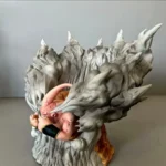 Dragon Ball Majin Buu Display Base Stand – Intricate pink Buu Statue in dynamic pose on textured gray rocky custom stand, vibrant anime collectible.