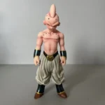 Dragon Ball Majin Buu collectible statue with textured base, pink skin tones, beige pants, black/gold wristbands, and minimalist background highlighting anime details